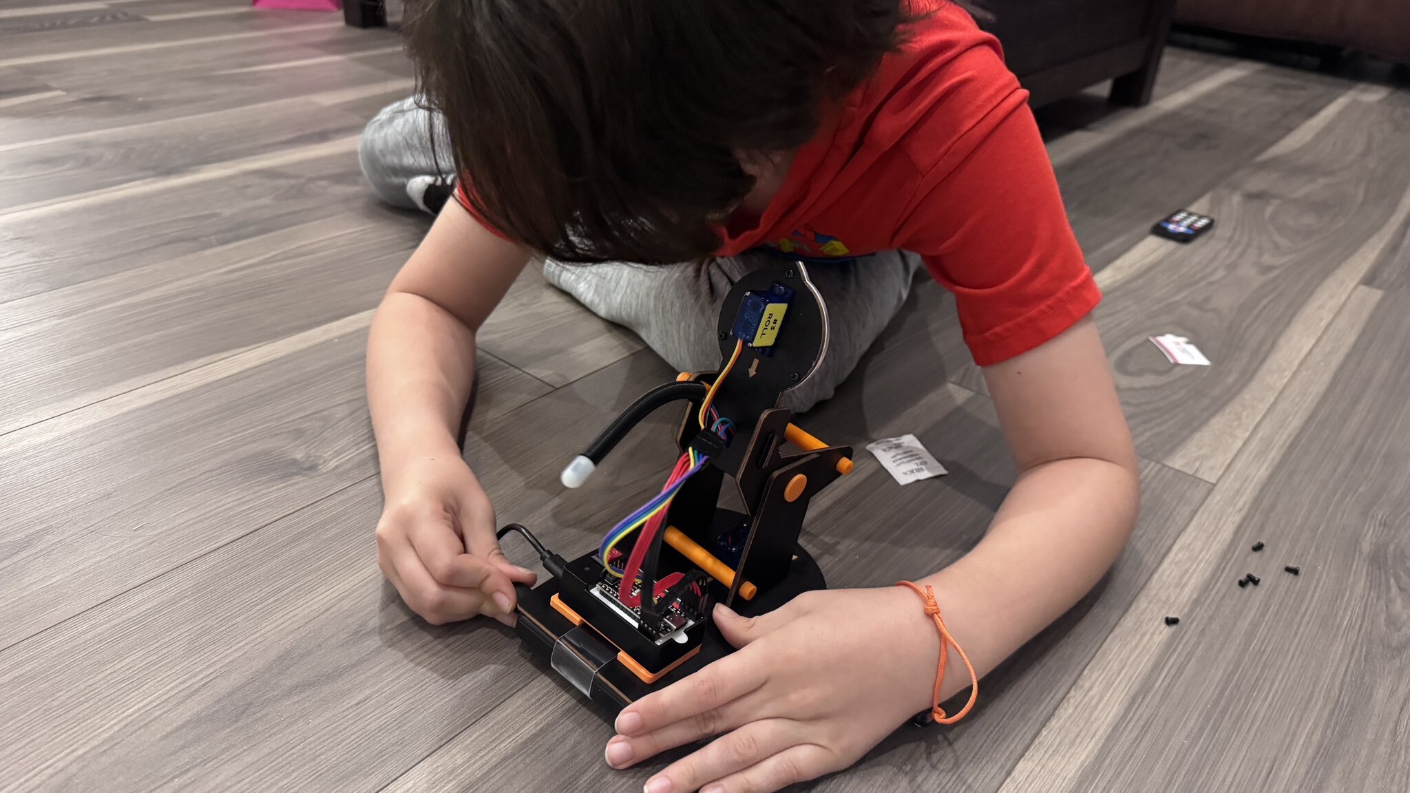 A child sitting with Nani using an iPad together
